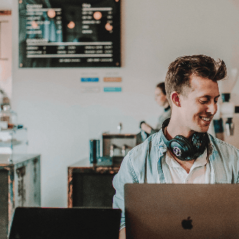 Picture of man smiling with laptop